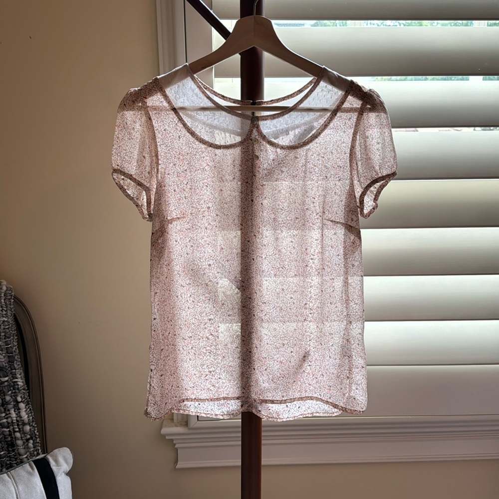 Sheer top with back zipper detail